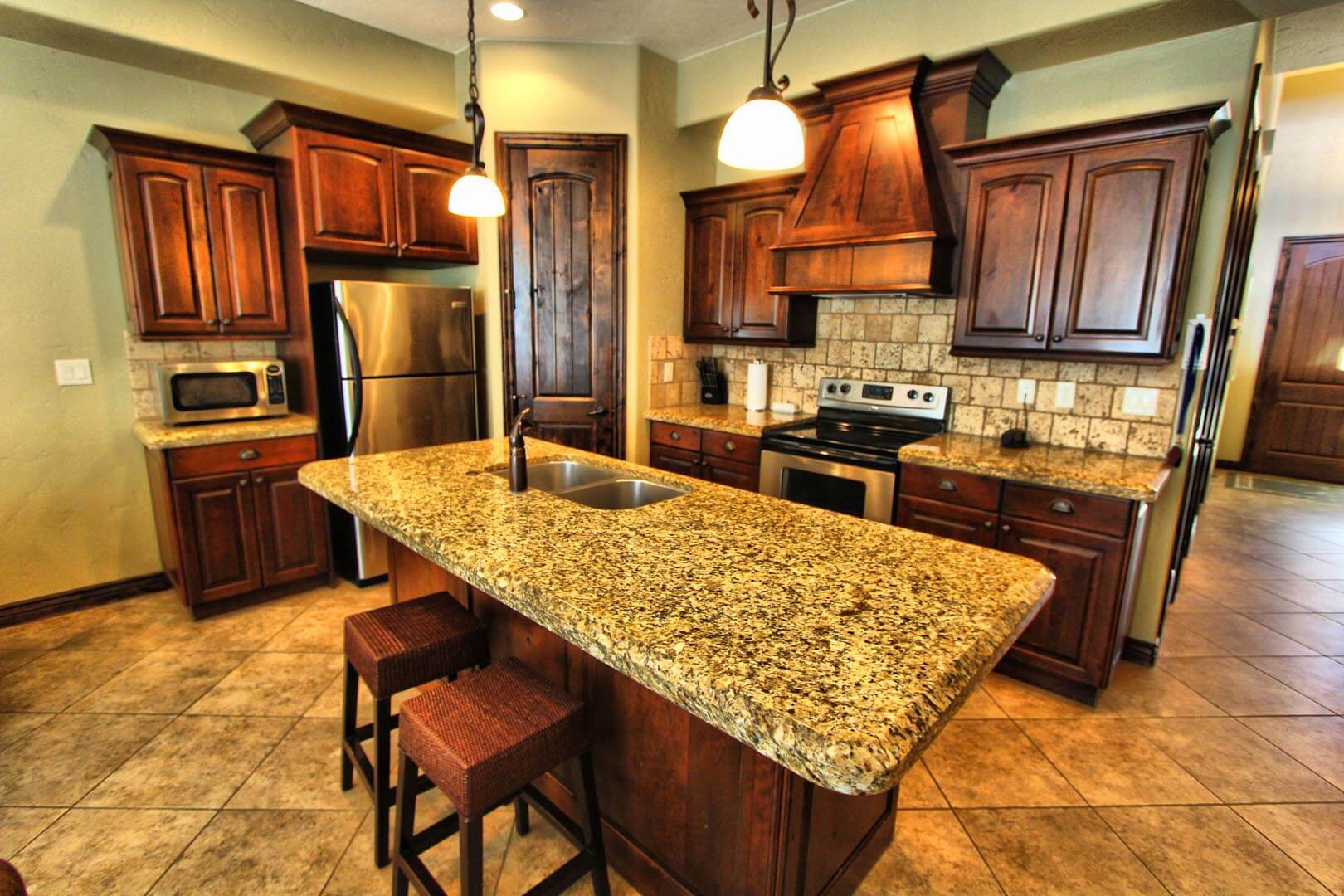 A fully equipped kitchen at VRI's Canyon Villas at Coral Ridge in Washington, Utah.